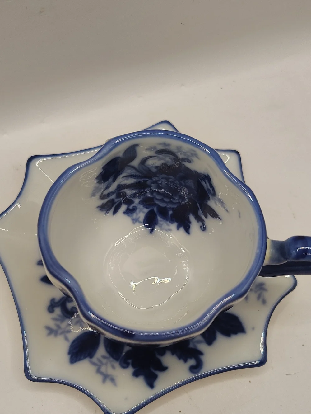 Blue and White Floral Porcelain Teacup with Matching Saucer